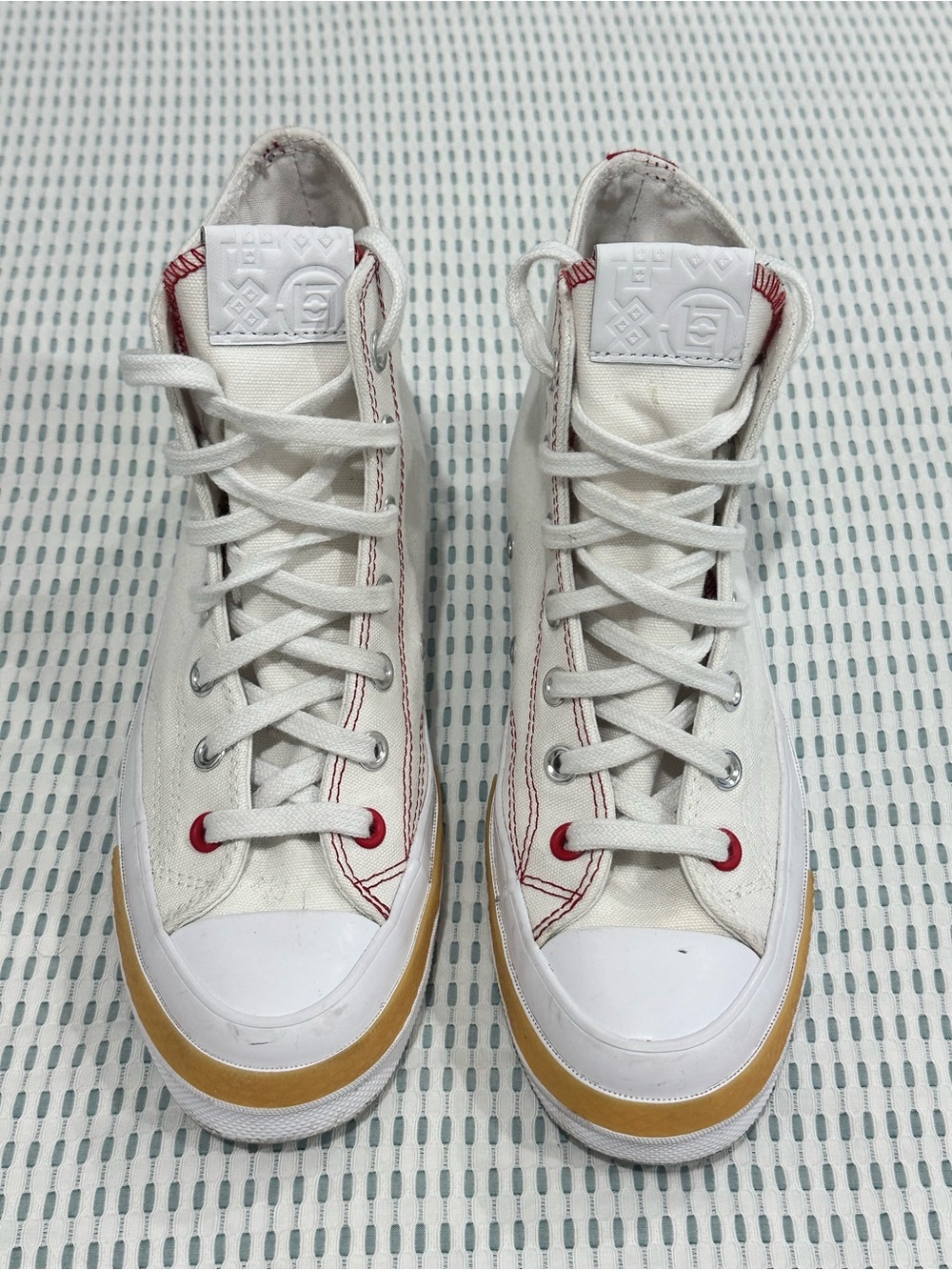 CLOT x Converse White High-Top Sneakers with Red Stitching and Tan Midsole